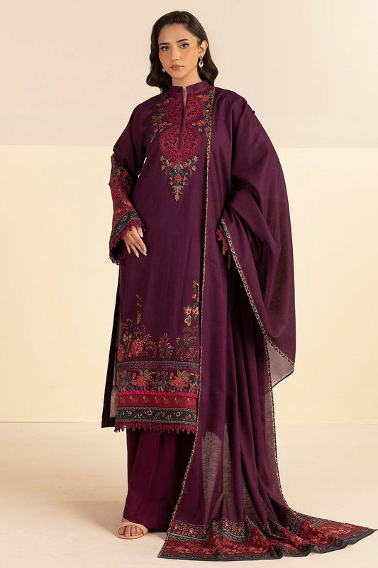 Woman wearing a purple embroidered traditional outfit on a beige background