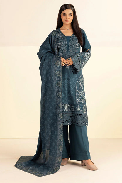 Woman wearing a blue embroidered traditional outfit on a beige background