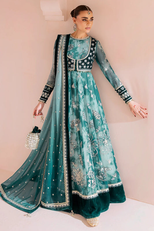 Woman wearing a traditional teal and green embroidered luxury wear dress in Australia